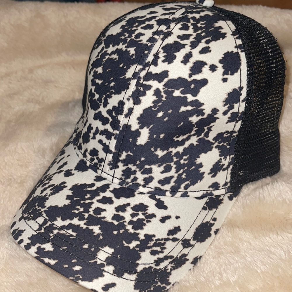 Crazy train Cow print cross cross pony tail